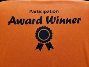Carrot Stick Sports Shirts Participation Award Winner t-shirt Participation Award Winner t-shirt. Orange shirt with award ribbon